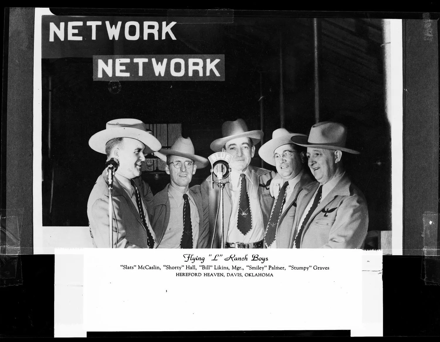 Photograph of The Flying "L" Ranch Boys band, Davis, OK. Photo taken by Meyers Photo Shop for the Flying "L" Ranch Boys Acct.