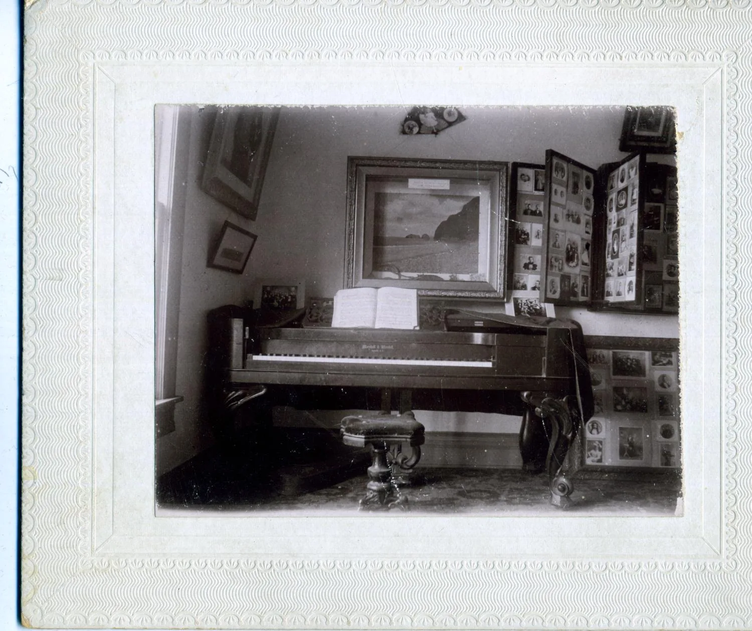 Photograph of the Print Sales Room at Frank L. Saunders' Studio, Woodward, Oklahoma Territory, with his mother's first piano, which was shipped from Illinois when she married. Photo by Frank L. Saunders, Woodward, Oklahoma Territory.