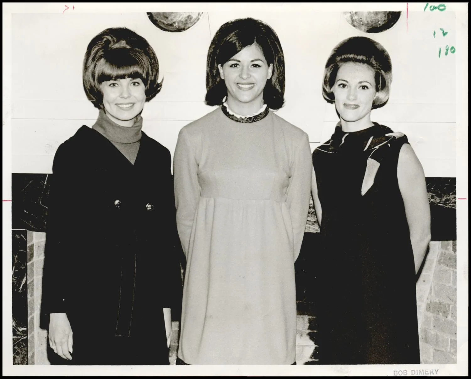 Photograph taken for a story in the Daily Oklahoman newspaper. Caption: "at Oklahoma State University are, from left, Christeen Sheets, Tulsa education major; Kathy Lauderdale of Yale, majoring in clothing and textiles merchandising, and Linda Davis, education major from Oklahoma City."