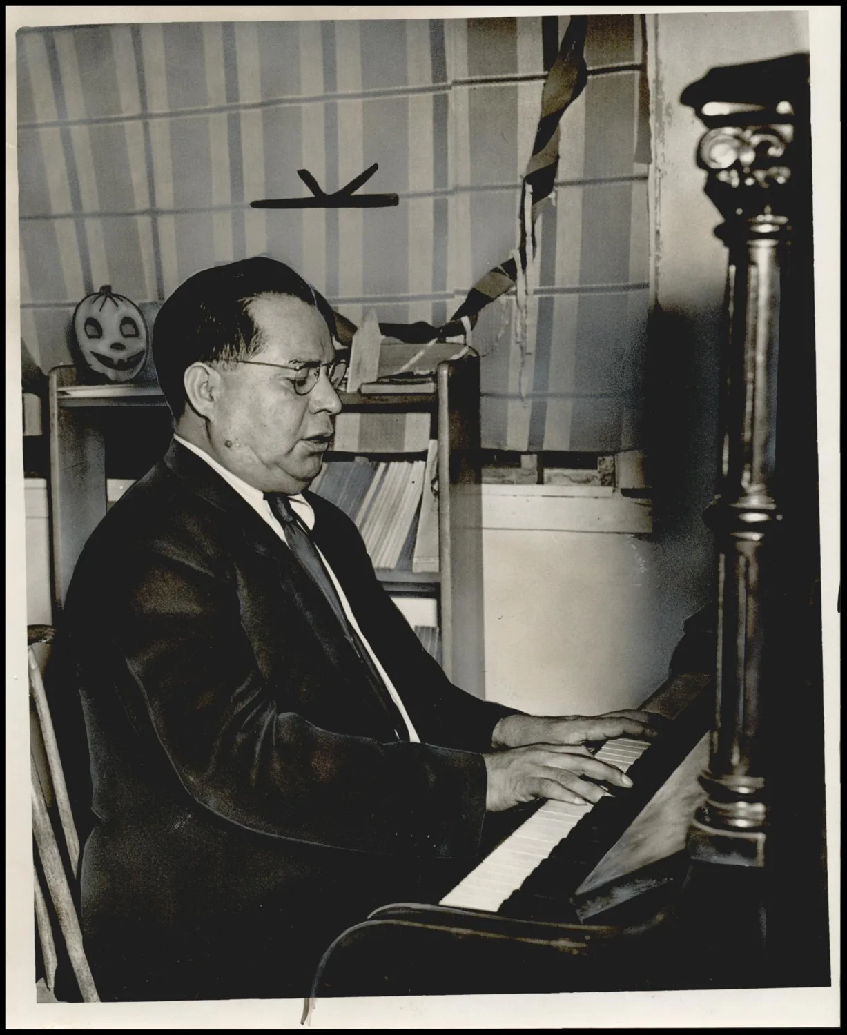 Photograph taken for a newspaper owned by the Oklahoma Publishing Company. Caption: "This is the Methodist-Baptist piano, home once more in the Methodist mission at 1509 S Robinson, after being in the possession of Capitol Hill Baptists for five days."