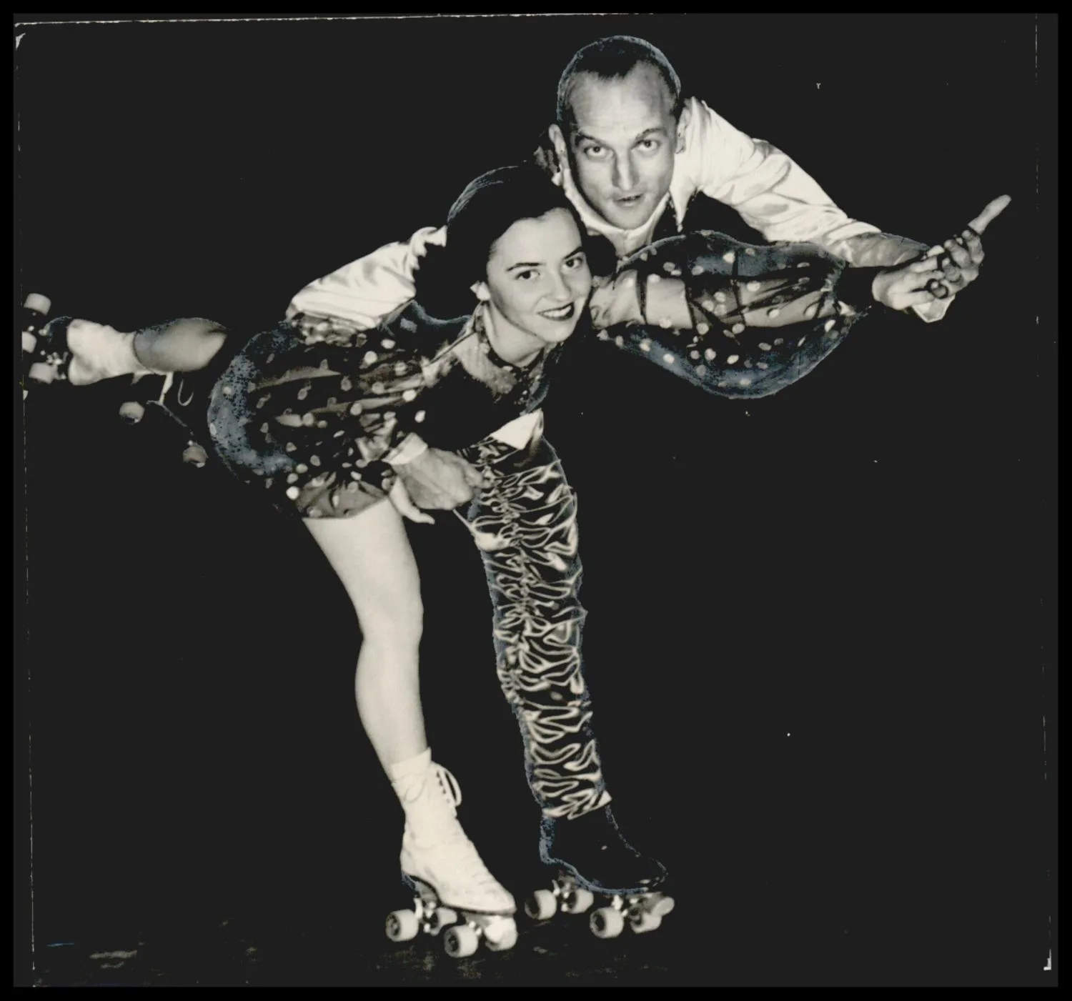 Photograph used for a story in the Daily Oklahoman newspaper. Caption: "Miss Carolyn Ratcliff and Tom Brown Brittain, director-producer, as they appear in a production number from the Follies."