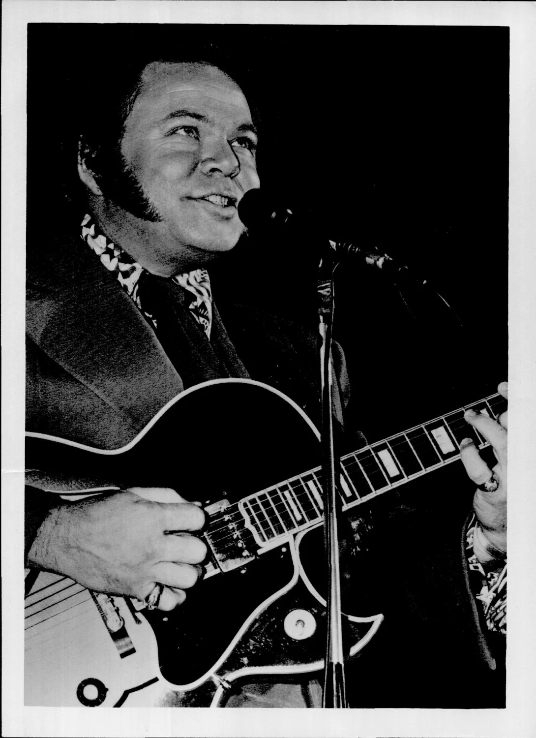 Clark Roy with guitar.