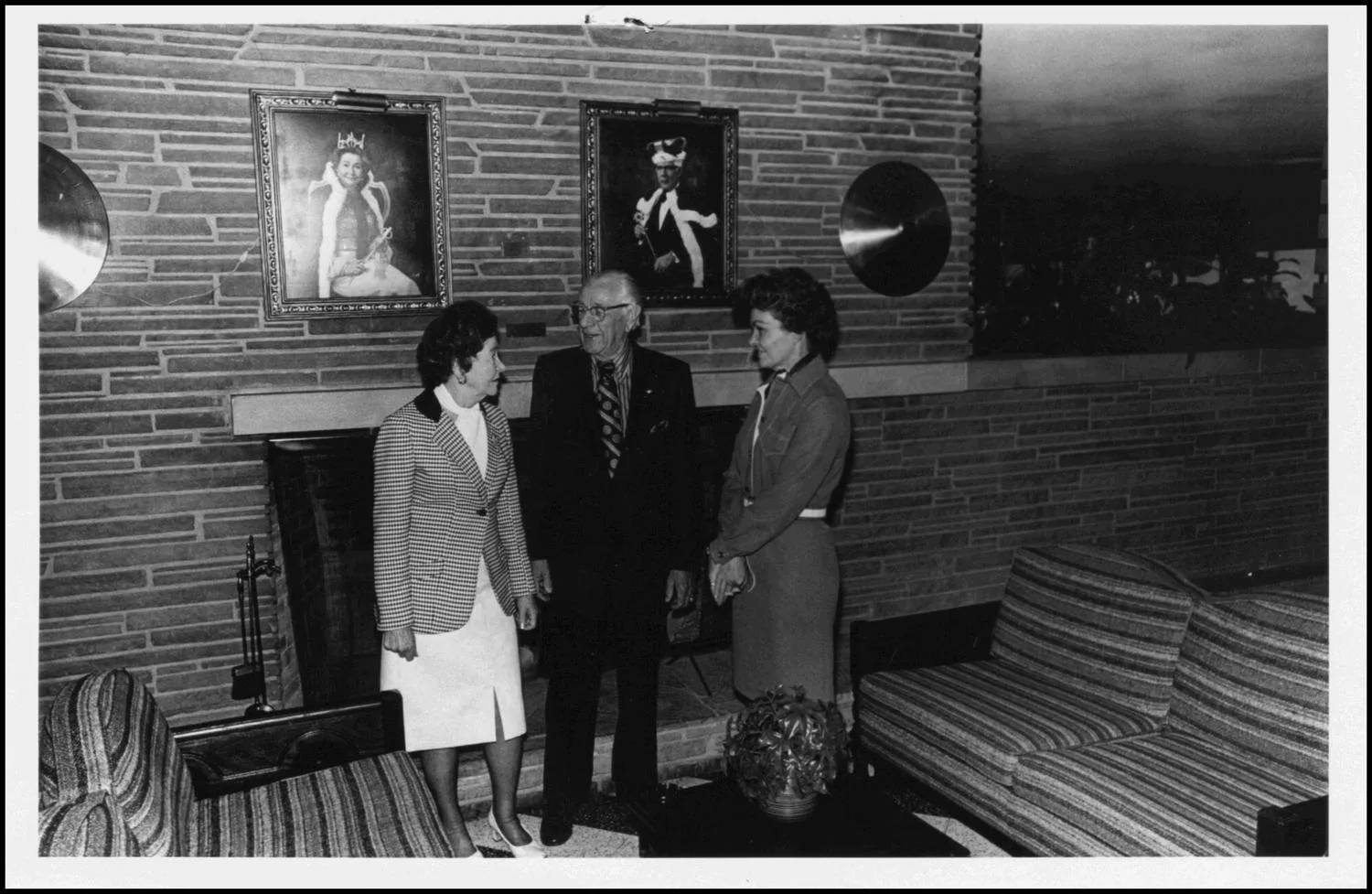 Photograph taken for a story in the Oklahoma Journal newspaper. Caption: "For those who would rather stay inside and visit, quiet lounges, decorated in warm shades of brown, orange and gold, are available. At right, Wanda Dawson, (right) , acting manager meets with club president, H.D. fiddler, and his wife, this years queen." Headline: Lakeview Country Club.