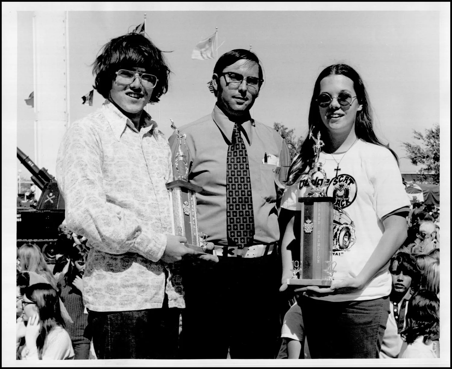 Photograph taken for a story in the Oklahoma Journal newspaper. Caption: "Photograph of Randy Grady, Linda Rodgers, and Ed White" Headline: Fair State, 1972.