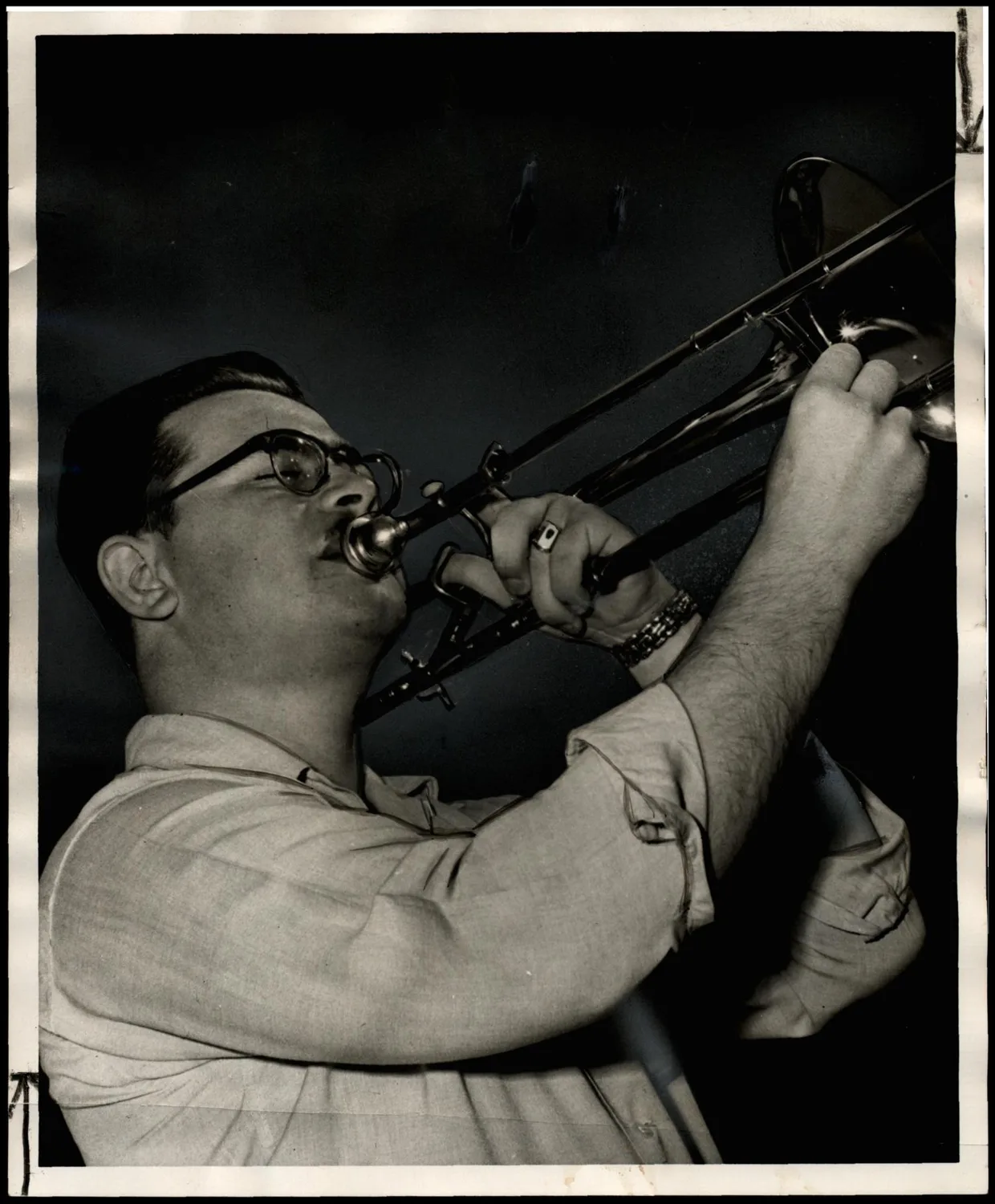 Photograph used for a story in the Oklahoma Times newspaper. Caption: "WALTER LONGSTREET of Pawhuska gives it all he's got in a rehearsal for a talent show to be staged by independent students of Oklahoma A&M in the college auditorium Thursday."