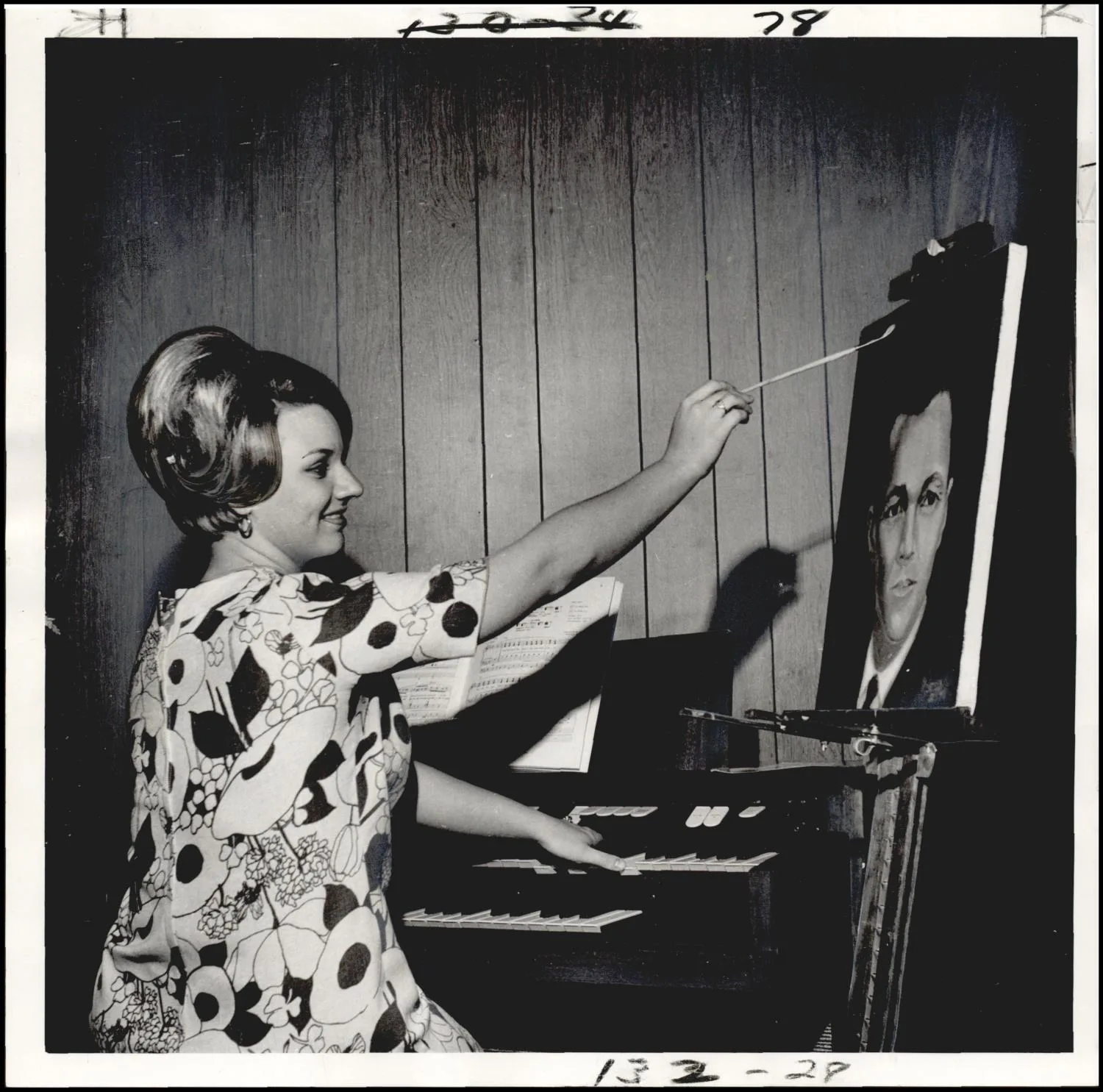 Photograph used for a story in the Oklahoma Times newspaper. Caption: "Piano and art brush are big items in life of Duncan's talented young Miss Becky Smith."