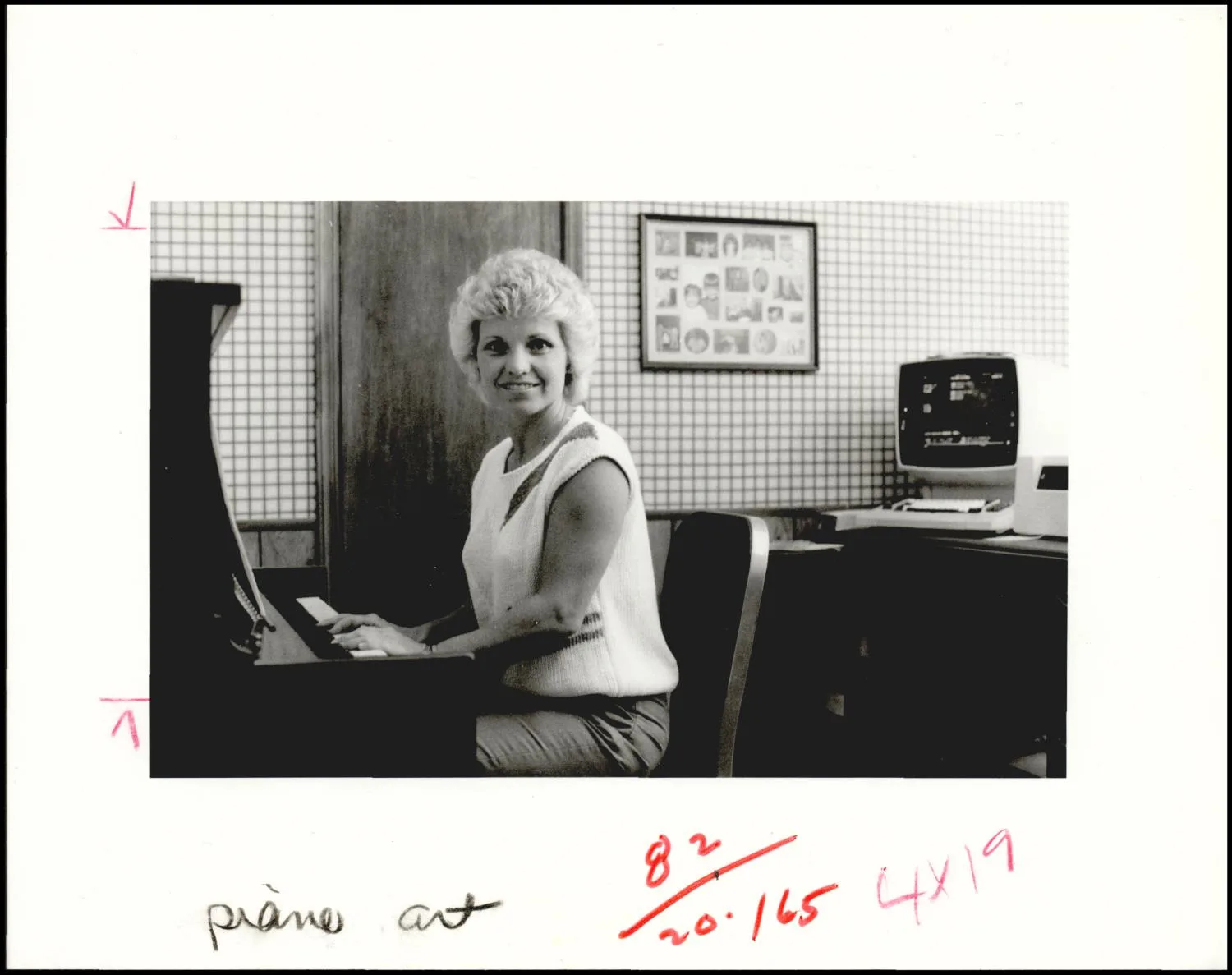 Photograph used for a story in the Daily Oklahoman newspaper. Caption: "Shiela Spurlock can swivel back and forth between her computer and piano."