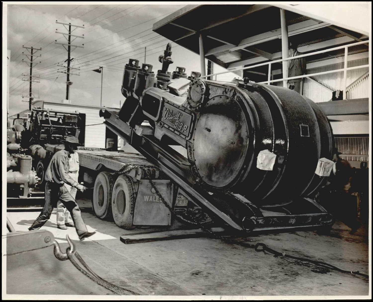 Photograph used for a story in the Daily Oklahoman newspaper. Caption: "Thursday morning gates will open, flags will be unfurled and the band will blare forth, opening the oil industry's greatest show: The International Petroleum Exposition at Tulsa."