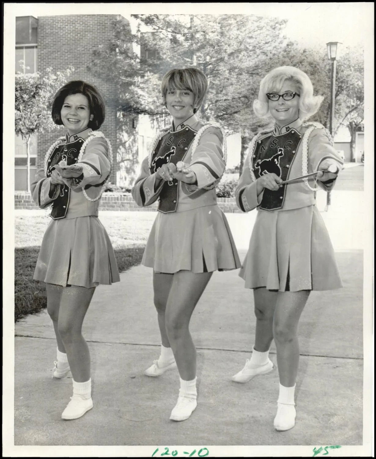 Photograph used for a story in the Oklahoma Times newspaper. Caption: "Together for third year as twirlers of the Ranger Band at Northwestern State College at Alva are Judy Potter, left, of Laverne, Karen Wilson, of Fairview, and Ferral Lochner, of Enid."
